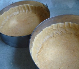 The cake forms with the baked bottom in place and with remaining dough pressed along the sides.